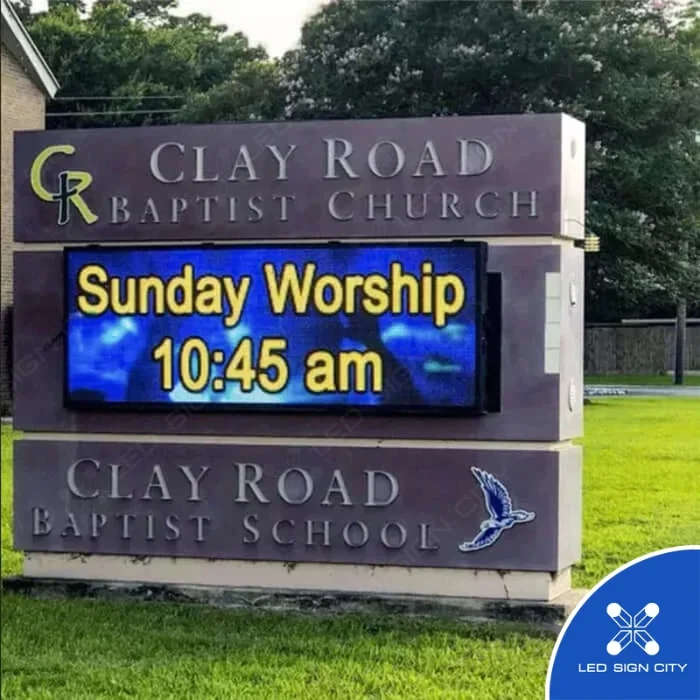 Clay Road Baptist Church monument sign showing Sunday Worship service times on a full-color LED display